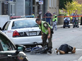 Quebec police reconstruct the scene of an accident after cyclist Guy Blouin died. (AURELIE GIRARD/QMI Agency)