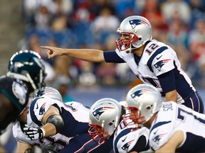 New England Patriots quarterback Tom Brady calls a play against the Philadelphia Eagles during the first half at Gillette Stadium on August 15, 2014. (Mark L. Baer/USA TODAY Sports)