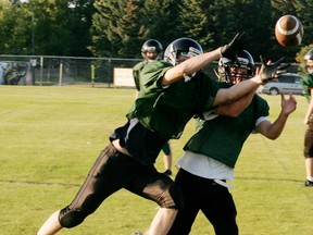 A receiver and a defensive back battle for the ball during a passing drill at their camp held over the last week in preparation for the new Metro League season that begins this week for both the senior and junior teams. - Gord Montgomery, Reporter/Examiner