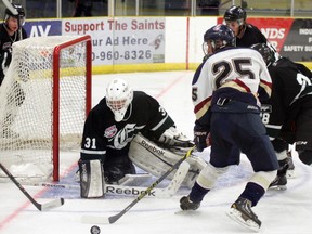 Josh Harris, one of the players trying out for the Spruce Grove Saints, had a bit of bad luck on this play as the puck hopped over the blade of his stick as he attempted to score on the Sherwood Park Crusaders’ Zac Klassen. The Saints could have used the goal in a 2-1 pre-season loss to the Cru. - Gord Montgomery, Reporter/Examiner