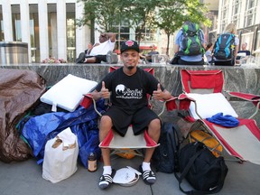 Joseph Cruz, 21, of Staten Island, New York is one of the first in line outside the Apple store in New York city on Thursday Sept. 4, 2014. (Marie-Joelle Parent/QMI Agency)