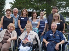 The Hennig family threw a party when they received their bronze plaque from the provincial government. Everyone pictured here has lived on the farm at one point. Clockwise from top left: Lorraine and Dennis Hennig, daughters Nicole Brockhoff, Melanie Hennig and Andrea Debolt, brother Randy Hennig and sister-in-law Lois Hennig, uncle George Hennig, aunt Alma Boles and sister Carole Lapointe. - Photo Supplied