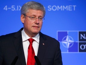Canada's Prime Minister Stephen Harper speaks during a news conference on the second and final day of the NATO summit at the Celtic Manor resort, near Newport, in Wales September 5, 2014.      REUTERS/Yves Herman