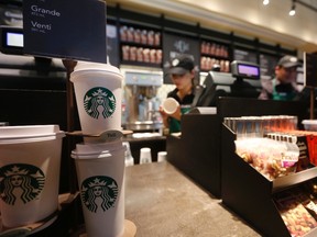 Paper cups of different sizes are seen on display at Starbuck's first Colombian store at 93 park in Bogota July 16, 2014. (REUTERS/John Vizcaino)