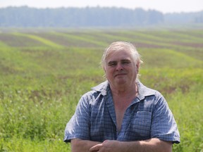 Watford farmer Wayne Edwards shows off the site of his former family homestead near Zion Line and Underpass Road Friday. At one point, he says 50 acres of woodlot use to blanket that stretch of land west to First School Road. He is concerned the County of Lambton is not enforcing its woodlot conservation bylaw strictly enough. (BARBARA SIMPSON, The Observer)