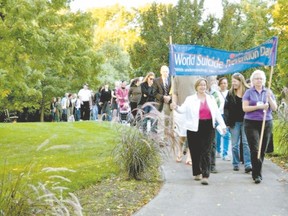 People participate in last year?s memorial walk to mark World Suicide Prevention Day. This year?s event is being held Wednesday, starting at 6:30 p.m. in London?s Victoria Park. (Special to The Free Press)
