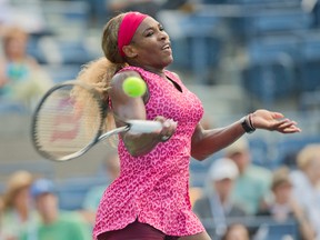 Serena Williams returns a shot against Ekaterina Makarova during U.S. Open semifinal action in New York on Friday, Sept. 5, 2014. (Susan Mullane/USA TODAY Sports)