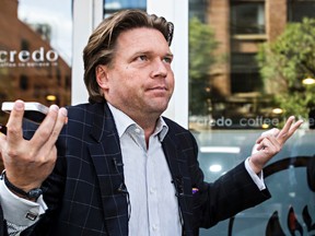 Alberta Progressive Conservative leadership candidate Thomas Lukaszuk gestures after casting his leadership vote electronically at Credo Coffee in Edmonton, Alta., on Friday, Sept. 5, 2014. When asked whether or not it worked, Lukaszuk remarked that the electronic voting process was confusing. Codie McLachlan/Edmonton Sun