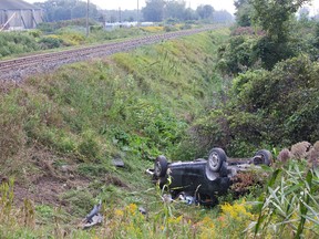 A woman was killed when the car she was in collided with a Via Rail on Melbourne Road west of London Ontario on Friday, September 5, 2014. (DEREK RUTTAN, The London Free Press)
