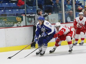 Nick Baptiste, left, of the Sudbury Wolves, skates around Charley Graaskamp, of the Soo Greyhounds, during OHL exhibition action at the Sudbury Community Arena on Friday night.