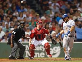 Toronto Blue Jays left fielder Melky Cabrera (53) winces after swinging at a pitch against the Boston Red Sox during the sixth inning at Fenway Park on Sep 5, 2014 in Boston, MA, USA. (Mark L. Baer/USA TODAY Sports)