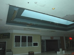 A quick roof inspection by firefighters above the food court area at Elgin Mall in St. Thomas revealed a sink area, possibly due to the heavy rain Friday night and into Saturday. IAN MCCALLUM / TIMES-JOURNAL