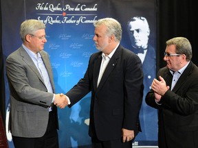 Prime Minister Stephen Harper and Quebec Premier Philippe Couillard at a press conference at the Chateau Frontenac in Quebec City, Que., Saturday, Sept. 6, 2014.