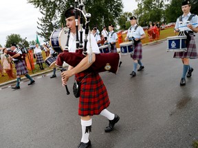 The 24th annual Trenton Scottish Irish Festival kicked off with a military tattoo Friday night with a parade and march past – seen here – kicking off Saturday's events at Centennial Park in Trenton, Sept. 6, 2014. 
Emily Mountney-Lessard/The Intelligecer/QMI Agency
