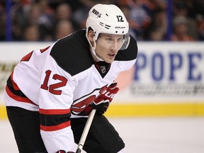 New Jersey Devils right wing Damien Brunner chases defenseman Erik Karlsson. Brunner could be one of the forwards the Senators are looking to trade for. Ian Kucerak/QMI Agency