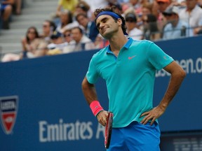 Roger Federer of Switzerland reacts after a missed point against Marin Cilic of Croatia during their semi-final match at the 2014 U.S. Open tennis tournament in New York, September 6, 2014. (REUTERS/Mike Segar)