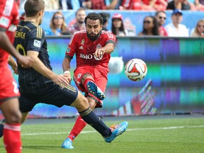 Toronto FC midfielder Dwayne De Rosario plays the ball against the Philadelphia Union at BMO Field yesterday. The free-falling Reds were booed throughout the game. (Tom szczerbowski/USA Today Sports)
