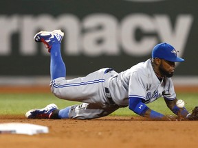 Blue Jays shortstop Jose Reyes bobbles a ground ball Friday night against the Red Sox. (USA Today Sports)