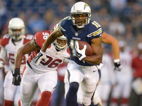 San Diego Chargers wide receiver Seyi Ajirotutu (16) runs with the ball as Arizona Cardinals defensive end Kareem Martin (96) chases in the first half at Qualcomm Stadium on Aug 28, 2014 in San Diego, CA, USA. (Robert Hanashiro/USA TODAY Sports)