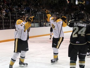 Alexandre Renaud (left) and Brandon Lindberg celebrate Renaud's 2nd period goal while taking on the London Knights in pre-season action at the RBC Centre on Saturday, Sept. 6. Renaud scored a pair of goals in what was a 7-1 Sarnia victory. SHAUN BISSON/ THE OBSERVER/ QMI AGENCY​