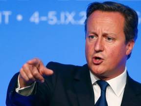 Britain's Prime Minister David Cameron speaks during a news conference on the second and final day of the NATO summit at the Celtic Manor resort, near Newport, in Wales September 5, 2014.       REUTERS/Andrew Winning