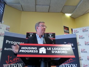 Mayor Jim Watson unveils his housing platform at his campaign office in Chinatown on Sunday, Sept. 7, 2014. JON WILLING/OTTAWA SUN