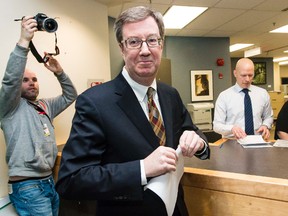 Ottawa Mayor Jim Watson finishes filing his election paperwork for the fall municipal election at the Client Service Centre at Ben Franklin Place. March 24, 2014. Errol McGihon/Ottawa Sun/QMI Agency