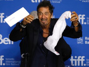 After three glasses of water spilled at the table Al Pacino and others do some cleanup at the press conference for Maglehorn at the TIFF Lightbox the Toronto International Film Festival in Toronto. Michael Peake/QMI Agency