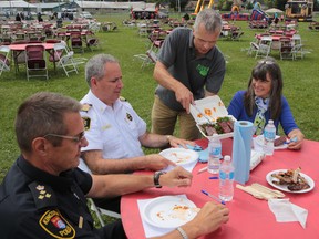 Kingston Ribfest and craft beer show organizer Guy Exley serves ribs to a panel of guest judges Saturday Sept. 6, 2014.ELLIOT FERGUSON/KINGSTON WHIG-STANDARD/QMI AGENCY