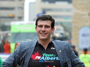 Mayor Don Iveson shows off his racing shirt after the family race at the Tour of Alberta in Edmonton, Alberta on September 7, 2014.  The Iveson family was returning to City Hall downtown. Perry Mah/Edmonton Sun/QMI Agency