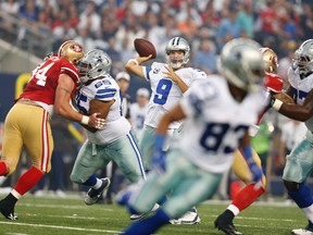 Cowboys quarterback Tony Romo threw three interceptions and was sacked three times against the 49ers on Sunday in Dallas. (USA TODAY SPORTS)