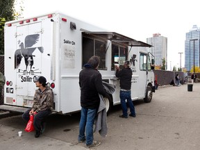 People line up for a free meal during the Bissell Centre Truck Stop in 2013. (EDMONTON SUN/File)