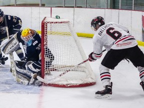 Gordie Ballhorn (right) shoves the puck into the net, tying the Whitecourt Wolverines home opener on Friday, Sept. 5 and clinching the win. Not only was it the rookie's first time hitting the ice for the Wolverines, it was his first goal in the AJHL. Bryan Passifiume | QMI Agency