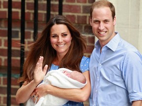 Britain's Prince William and his wife Catherine, Duchess of Cambridge appear with their baby son, outside the Lindo Wing of St. Mary's Hospital, in central London July 23, 2013. (REUTERS/Cathal McNaughton)