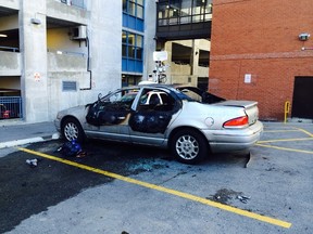 One of three vehicles were set ablaze at a multi-level Green P parking lot near Church St. and the Esplanade early Monday. (MARYAM SHAH/Toronto Sun)
