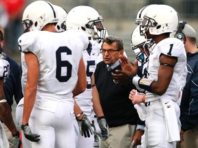 Penn State head coach Joe Paterno (C) coaches his team against Ohio State during the second quarter of their NCAA football game in Columbus, Ohio, in a November 13, 2010 file photo. (REUTERS/Matt Sullivan)