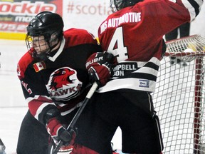 Greg Orr (4) of the Mitchell Hawks battles for offensive position beside the Walkerton net during exhibition action Saturday, Sept. 6 in Stratford. The same two teams square off in the Mitchell home opener this Sunday night. ANDY BADER/MITCHELL ADVOCATE