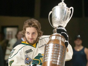 File photo
London Knights forward and Wallaceburg native Seth Griffith carries the J. Ross Robertson Cup, awarded to the Ontario Hockey League champions, onto the ice for a team photo at the John Labatt Centre in London on Monday May 28, 2012. After a sterling junior hockey career with the London Knights, Griffith is entering his second professional hockey season with the Boston Bruins.