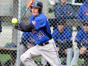 Kevin Quipp of the Mitchell Mets keeps his eye on the ball as it bounces in front of the plate during action Saturday of the South Perth Men’s Fastball League playoff tournament. ANDY BADER/MITCHELL ADVOCATE