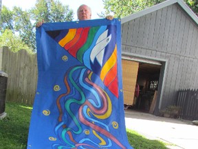 Artist David Moore holds a banner he created for the Sarnia-Lambton Suicide Prevention Committee. It will be used Wednesday evening at an event the committee is hosting at the Canatara Park bandshell as part of World Suicide Prevention Day. (PAUL MORDEN, The Observer)