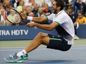 Marin Cilic of Croatia celebrates after defeating Kei Nishikori of Japan in their men's singles final match at the 2014 U.S. Open tennis tournament in New York, September 8, 2014. (REUTERS/Mike Segar)