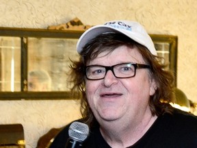 Michael Moore speaks at the SundanceNow Doc Club's TIFF luncheon with Michael Moore during the 2014 Toronto International Film Festival at Soho House on September 8, 2014 in Toronto, Canada. Jerod Harris/Getty Images/AFP