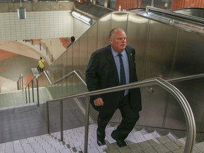 Toronto Mayor Rob Ford climbs the stairs during his Sheppard subway ride Monday, Sept. 8, 2014. (Dave Thomas/Toronto Sun)