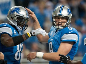 Detroit Lions wide receiver Calvin Johnson (81) celebrates his touchdown with quarterback Matthew Stafford.  (Tim Fuller-USA TODAY Sports)