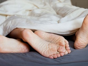 Spooning may not be the best way to have sex if you're a man with a bad back, a new study says. (Fotolia)