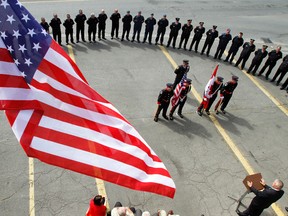 Members of Quinte West Fire Department pay a quiet homage to those who lost their lives in the terrorist attacks of Sept. 11, 2001 at Station 1 in Trenton, Ont. on Sunday, Sept. 11, 2011. - FILE PHOTO BY JEROME LESSARD/THE INTELLIGENCER/QMI AGENCY