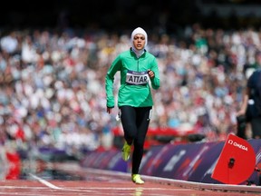 Saudi Arabia's Sarah Attar runs in her women's 800m round 1 heat at the London 2012 Olympic Games at the Olympic Stadium August 8, 2012. (REUTERS/Lucy Nicholson)