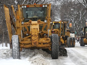 Graders and plows clear snow on Grosvenor Avenue near Guelph Street last winter.(Kevin King/Winnipeg Sun file photo)