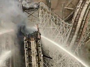 Part of the Colossus roller-coaster at Six Flags Magic Mountain in Valencia, Calif., was destroyed by fire Monday afternoon. (YouTube screengrab)