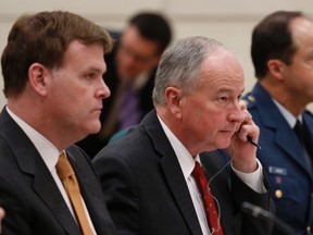 Canada's Foreign Minister John Baird (L-R), Defence Minister Rob Nicholson and Chief of Defence Staff General Tom Lawson wait to testify before the Commons foreign affairs committee on Parliament Hill in Ottawa September 9, 2014. REUTERS/Chris Wattie